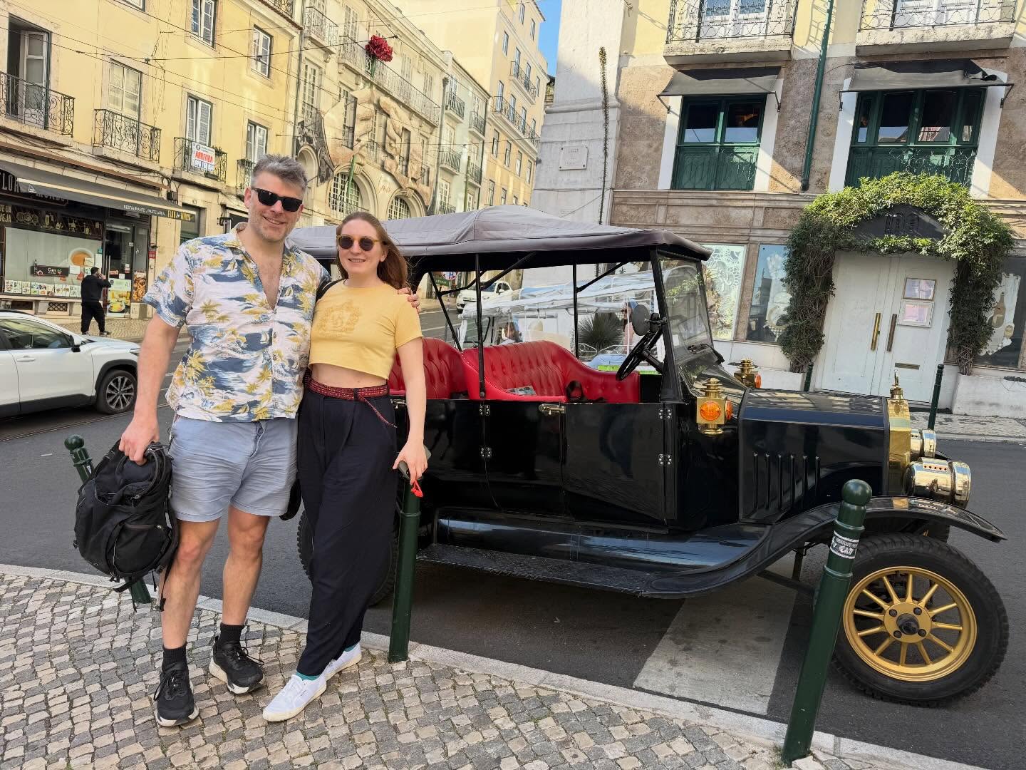 Happy customers with tour guide on a tuk tuk tour in Lisbon